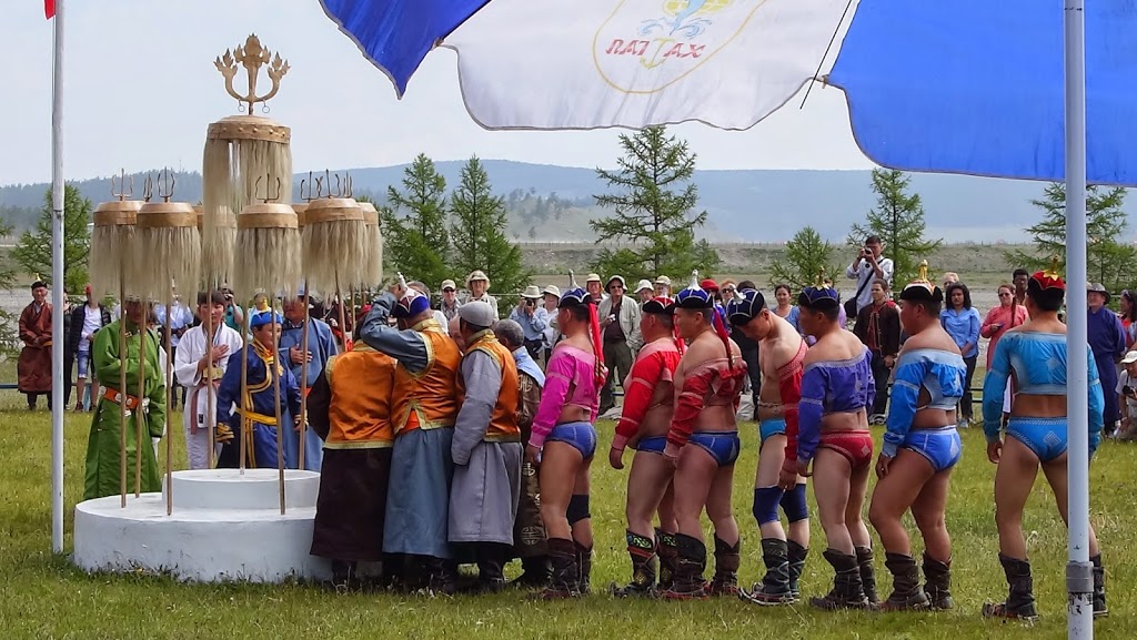 Local Mongolian wrestlers queuing to bless the state standard before the Mongolian wrestling tournament at Khatgal Naadam in northern Mongolia