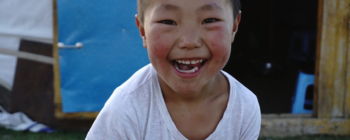 The beautiful smile of a local Mongolian boy from a herding family