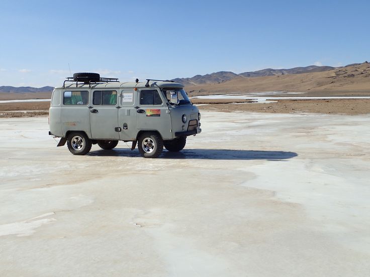 One of our beloved Russian Furgon 4x4 vans on the frozen surface of the Orkhon River in Ovorkhangai Aimag