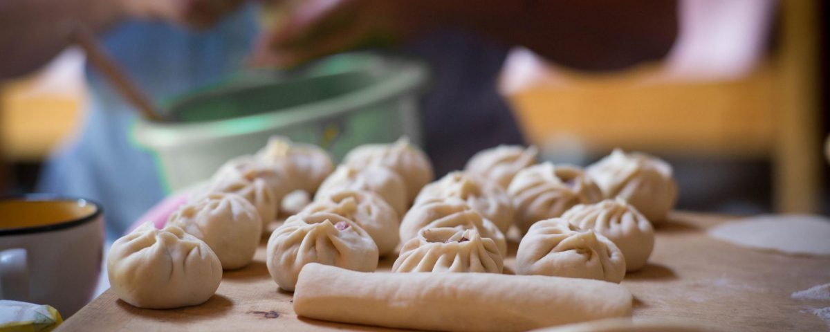 Mongolian dumplings being made by hand