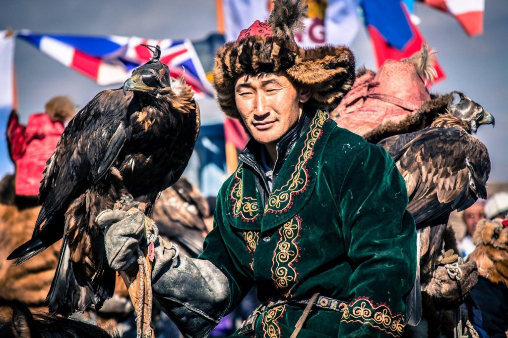 A Kazakh eagle hunter competitor and his eagle at one of the eagle festivals in Mongolia