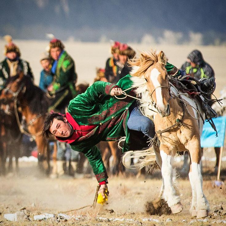 A Kazakh horseman during the Kumis Alu (pick up the coin) competition at one of the eagle festivals in Mongolia