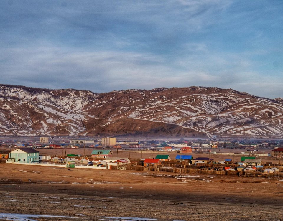 The town of Kharkhorin in central Mongolia with snow on the hilltops